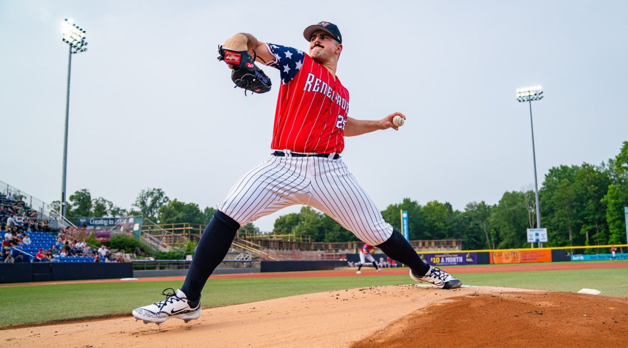 New York Yankees pitcher Carlos Rodon pitches for the Hudson Valley Renegades on a rehab assignment on July 1, 2023. He is wearing a special red, white and blue jersey with stars on the sleeves and white pants with dark blue pinstripes. Photo by Dave Janosz, courtesy of the Hudson Valley Renegades.